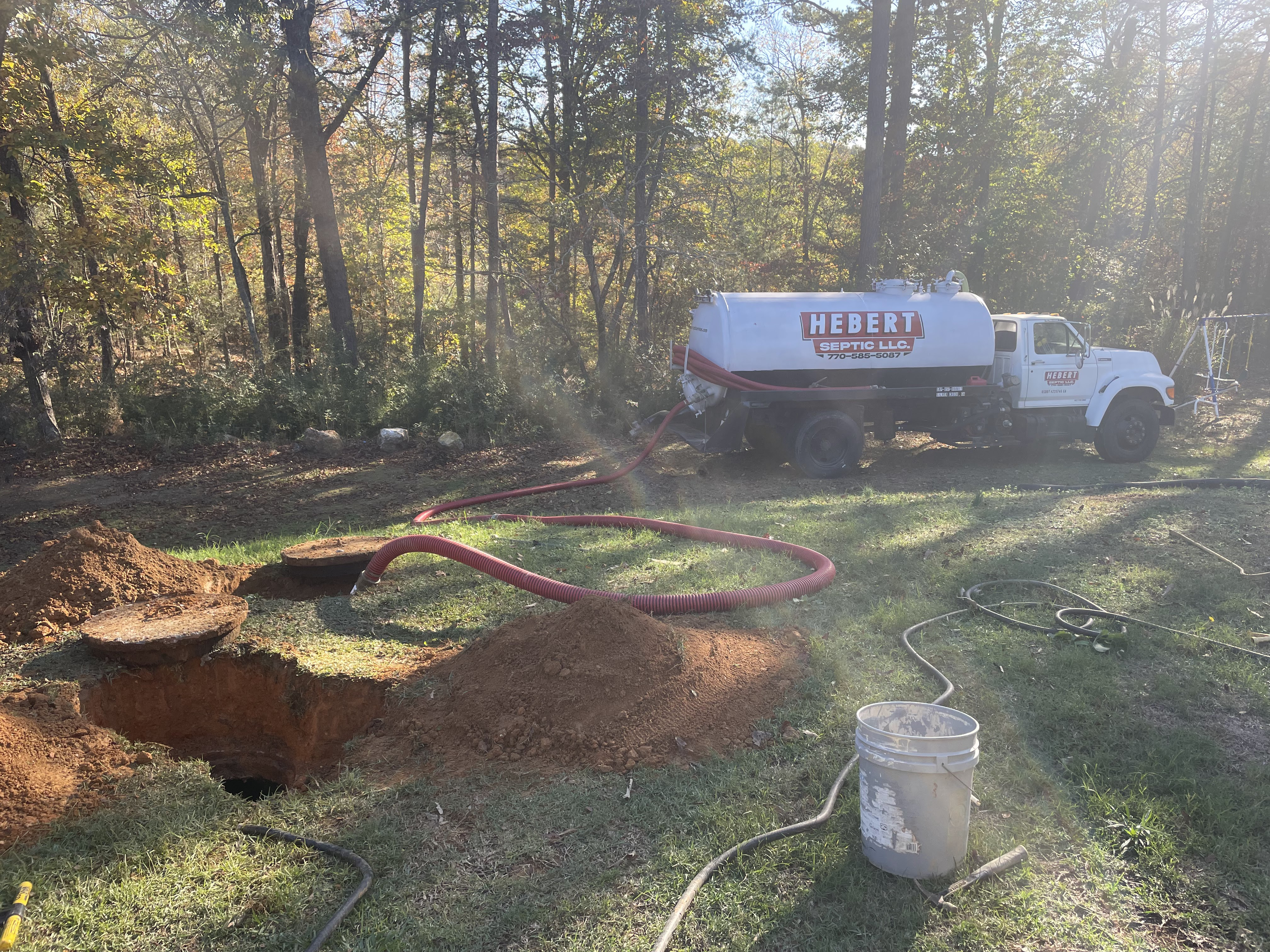 Septic draining using professional equipment